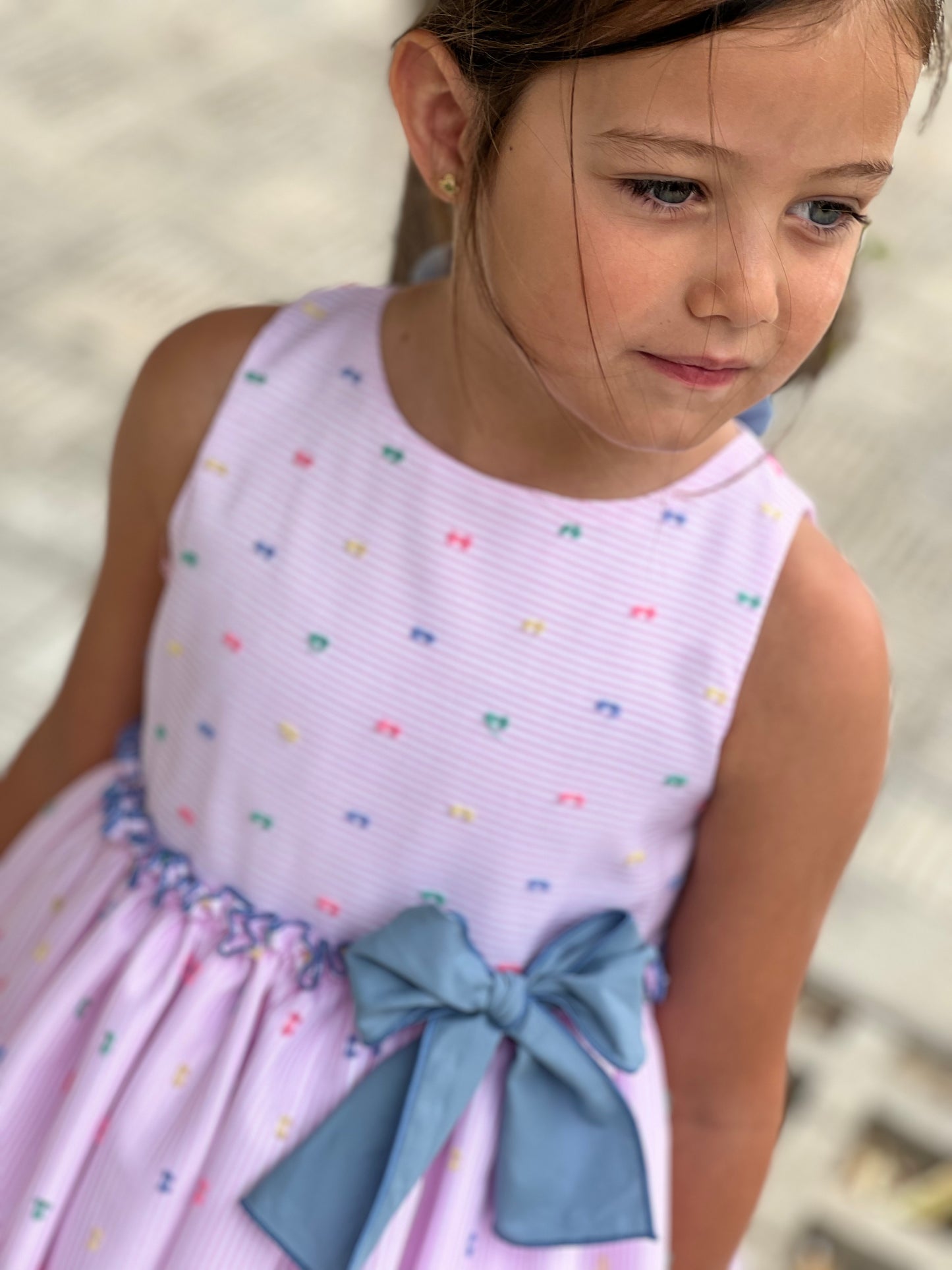 Pink dress with blue bow